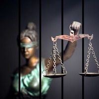 Justice Reaching Through Bars